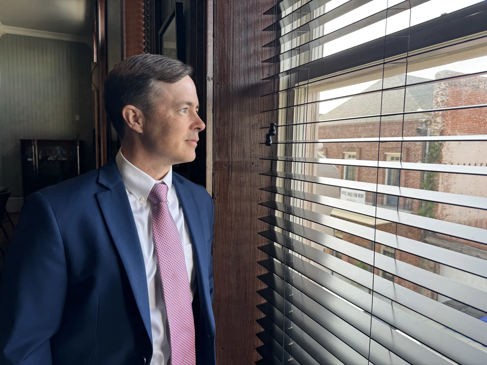 Paul Arceneaux at an office window in Thibodaux, Louisiana
