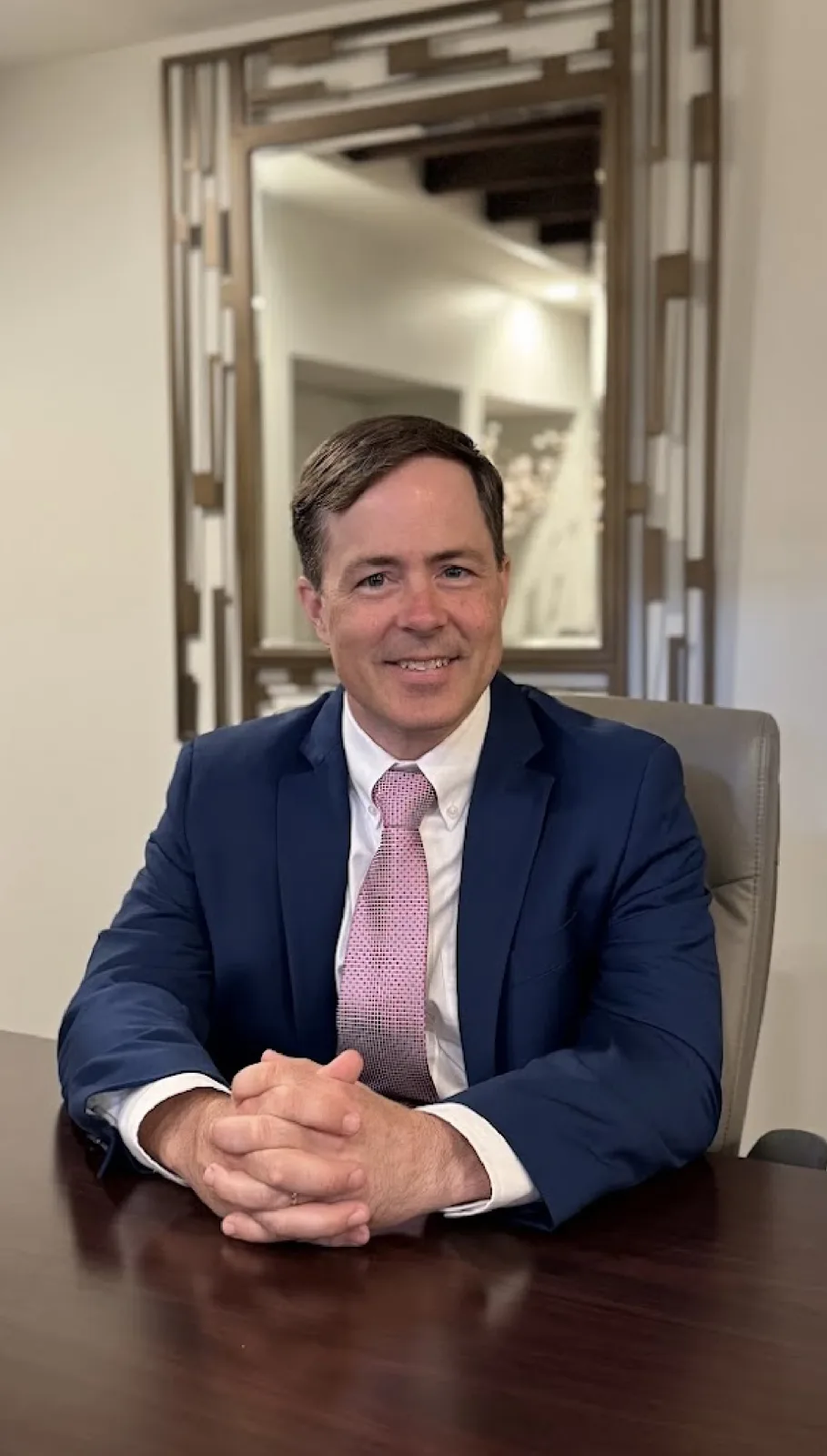 Paul Arceneaux seated at the conference table in his Thibodaux office